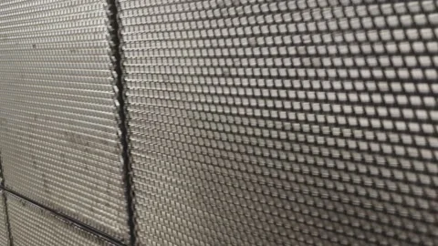 Expanded metal mesh wall creating modern architectural design Vidéo 315359360