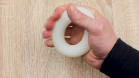 Expander ring for training the muscles of the forearm.Ring for hand training Stock Footage 253225057