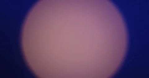 An expanding round light from a spotlight on the dark blue background of the Stock Footage 328658712