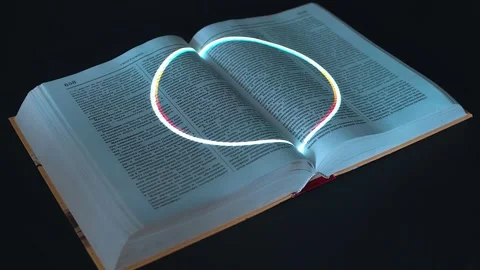 Expanding white ring is projected onto the pages of the thick open book Stock Footage 313175596