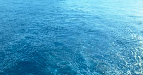 Expanse of ocean with visible ship wake patterns, cruise ship movement Stock Footage 323071717