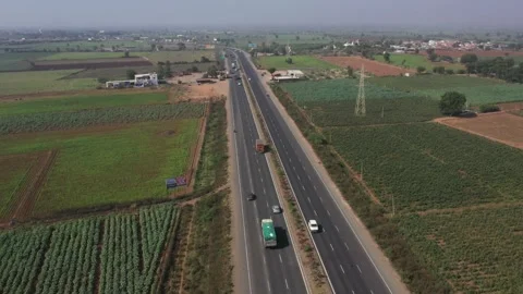 Expanse of patchwork agricultural fields and rural plains under a hazy morning Stock Footage 327533508