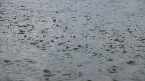 Expanse of river along which drops of heavy rain beating, tourists in boat aback Stock Footage 128275893