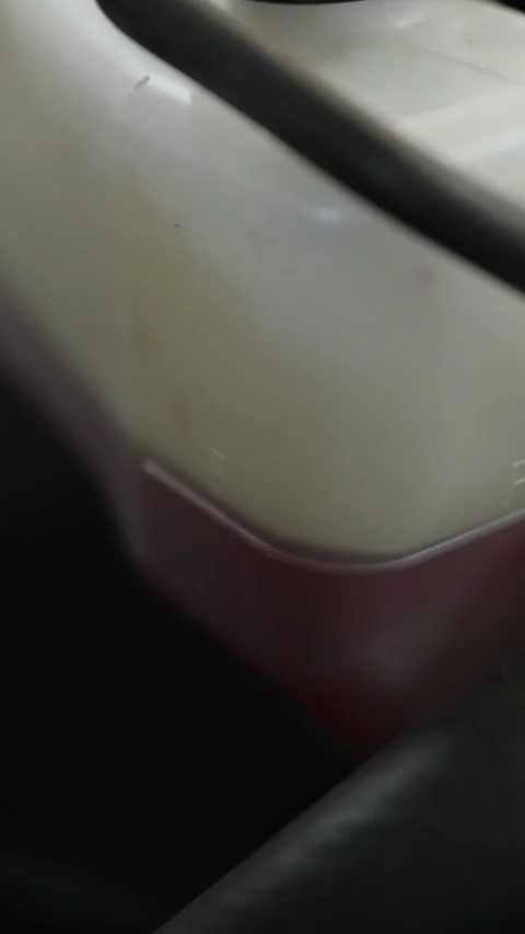 Expansion tank of the car cooling system with pink coolant Stock Footage 336711260