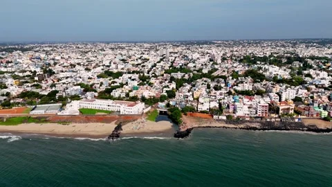 An expansive aerial drone shot captures the picturesque coastline of Puducherry Stock Footage 315129136
