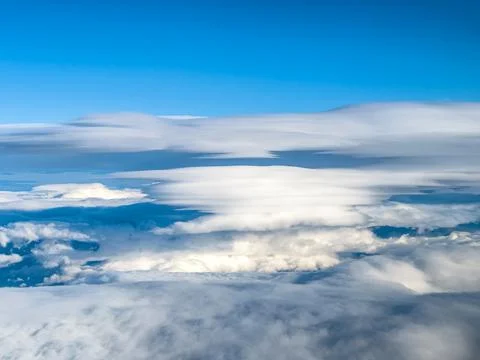 Expansive aerial landscape with dramatic lenticular cloud above distant mou.. 写真素材