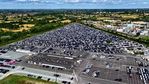Expansive aerial perspective of a new car terminal at the Port of Bordeaux Stock Footage 346580274