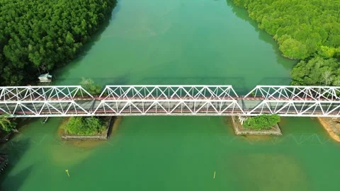 Expansive aerial perspective of a robust white truss bridge gracefully Video stock 325186883