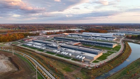 Expansive aerial view of a modern data center complex during a beautiful au.. Video stock 333602618