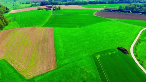 Expansive Aerial View of Patchwork Agricultural Fields in Spring Stock Footage 275268074