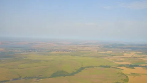 Expansive aerial view of patchwork farmland fields stretching across the ho.. Stock Footage 293087310