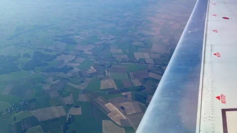 Expansive Aerial View of Patchwork Farmland from Airplane Window Stock Footage 313143615