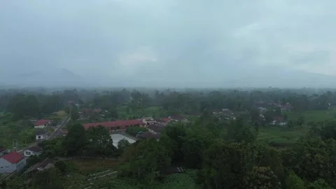 An expansive aerial view of a tranquil community veiled in ethereal morning.. Stock Footage 337269581