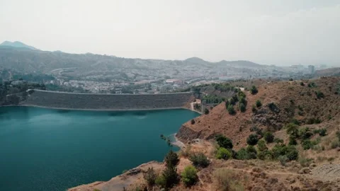 Expansive aerial view unfolding over a massive concrete dam and deep blue r.. Stock Footage 341685331