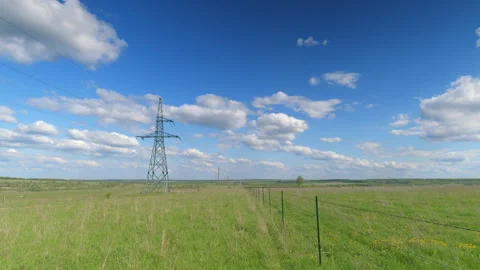 Expansive and Beautiful Landscape Featuring a Cloudy Sky Complemented by Power L Vídeo Stock 308858184