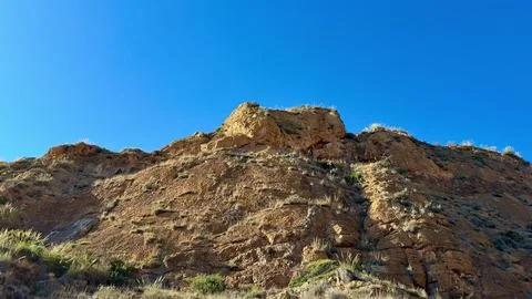 Expansive and Dramatic Desert Landscape Featuring Rocky Outcrops Set Beneat.. Stock Photos