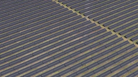 An expansive array of solar panels converts sunlight into clean electricity Stock-Footage 334309930