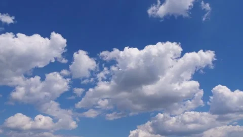 Expansive blue sky filled with fluffy white clouds, natural beauty Stock-Footage 318514287