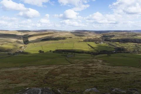 Expansive Countryside View with Rolling Hills and Green Fields Stock Photos