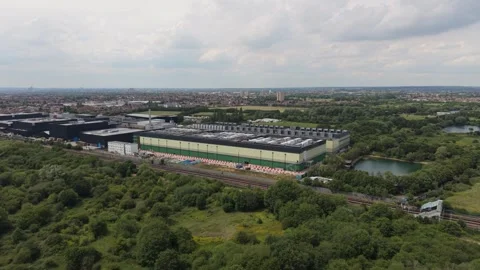 Expansive Data Centre Campus Aerial View Surrounded by Nature and Railway Tracks Stock Footage 339645321