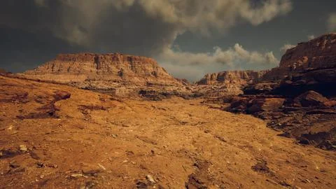 Expansive desert landscape showcasing dramatic rock formations at dusk Stock Illustration