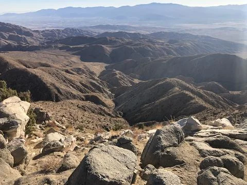Expansive Desert Landscape Under a Clear Sky in the Late Afternoon Stock Photos
