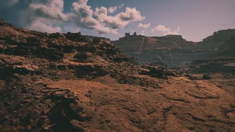 Expansive desert landscape under a dramatic sky near rugged cliffs at dusk Stock Illustration