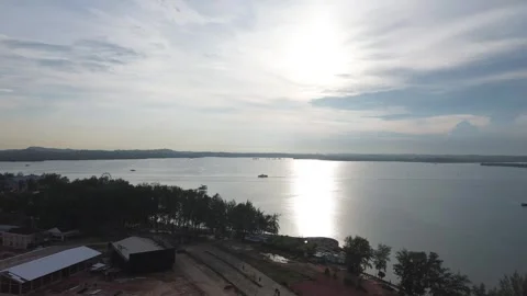 Expansive Drone View of a Shimmering Bay with Distant Shores 库存影片 325193438