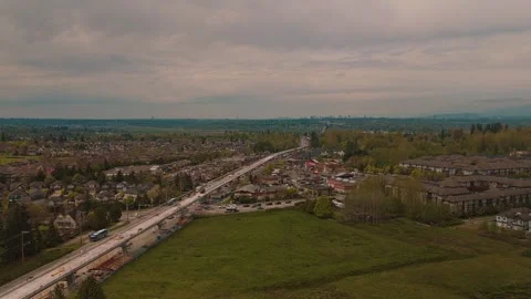 Expansive high altitude view highway traffic and transit construction orbit Vidéo 334248598
