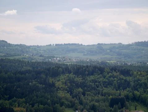 Expansive hills with forests and fields. Vast valley featuring layered hill.. Фото