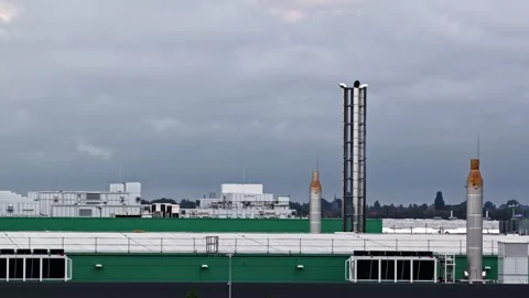 Expansive Industrial Data Center Buildings with Chimneys at Agriport A7 Stock Footage 344429147