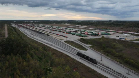 Expansive Intermodal Rail Terminal With Trains and Cargo Storage Stock Footage 337714786