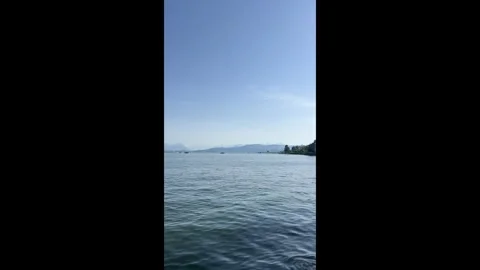 Expansive Lake View with Distant Boats Stock Footage 310326773