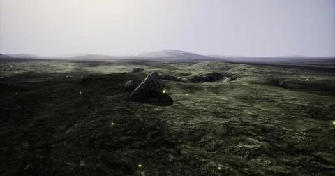 An expansive landscape features rolling green terrain under a misty sky 库存插图