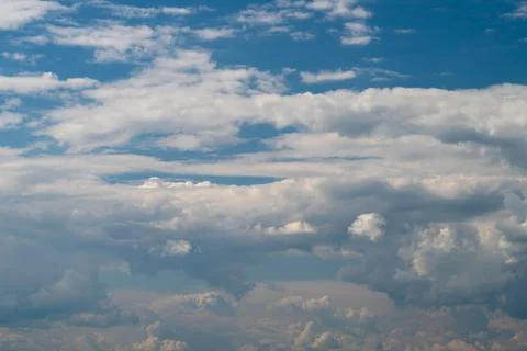 Expansive layered sky with dramatic cumulus and cirrus clouds Stock Photos