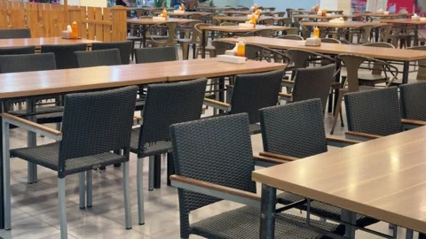 Expansive modern dining hall ready for patrons: a vast array of tables and .. Video stock 326034273