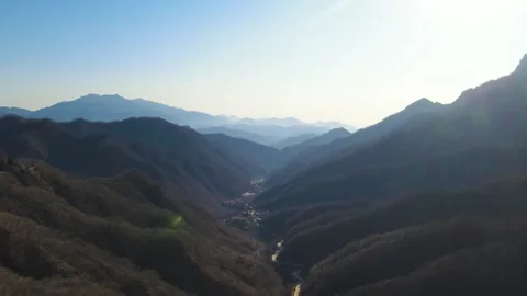 Expansive Mountain Ranges With Rolling Clouds 4K Aerial Stock Footage 320871655