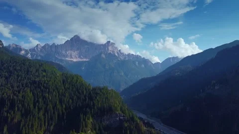 Expansive mountain ranges showcasing river valley in wilderness landscape Stock Footage 342500498