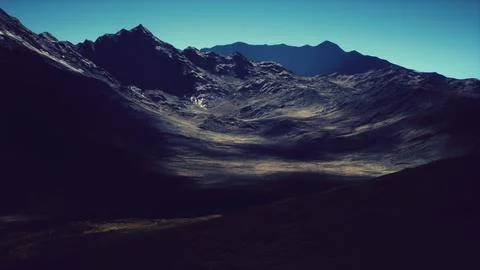 Expansive mountain valley under clear blue sky during the late afternoon Illustrazione stock