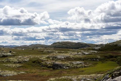 Expansive Norwegian Highlands with Dramatic Cloudy Sky Stock Photos