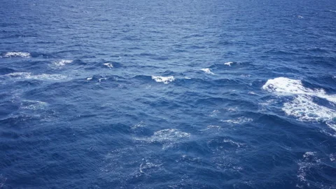 Expansive ocean surface engulfed in blue waves showcasing natural marine se.. Stock Footage 295257466