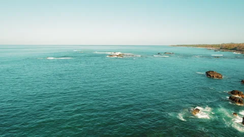 Expansive ocean view with rocky formations and calm blue water in Costa Rica Stock Footage 317723737