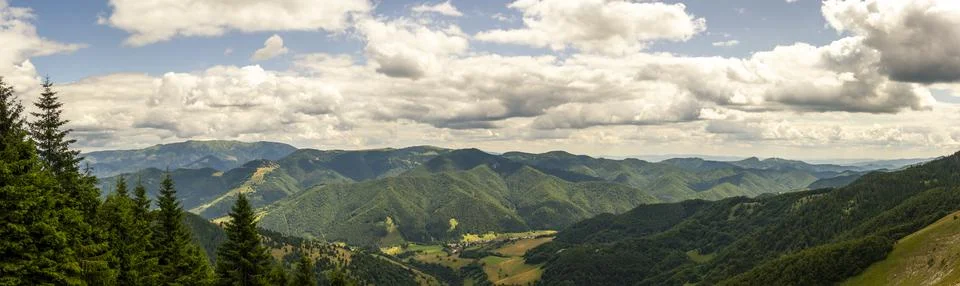 Expansive panoramic view featuring densely forested mountains rolling endle.. Stock Photos