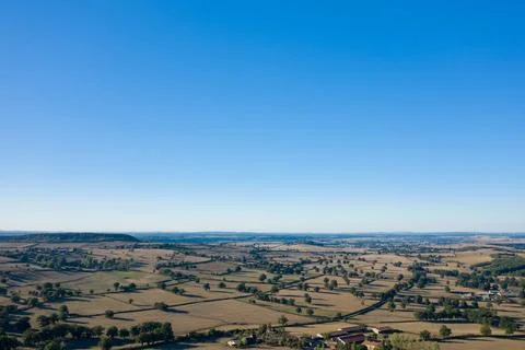 Expansive rural patchwork under clear blue sky Fotos de archivo