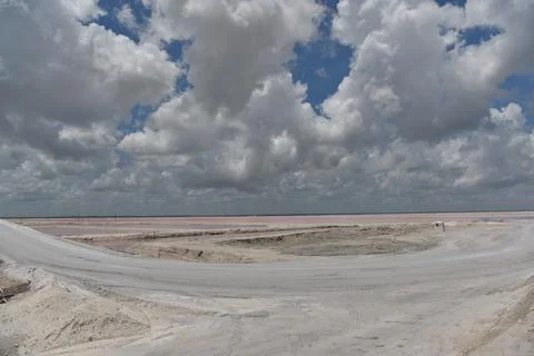 Expansive salt flat landscape under stormy clouds Stock Photos