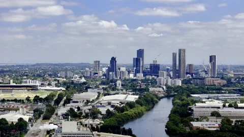 An expansive shot of Parramatta, Sydney, featuring a prominent river winding Stock-Footage 306680032