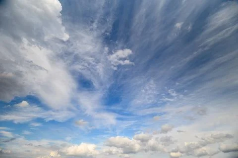 Expansive sky featuring streaked clouds. Vast sky with radiant cloud patter.. Stock Photos