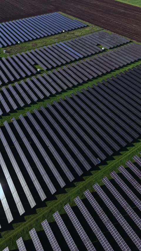 Expansive solar panel array capturing sunlight in a renewable energy facility Stock-Footage 332051016