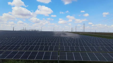 Expansive solar panel installation harnessing renewable energy in nature Stock Footage 312675675