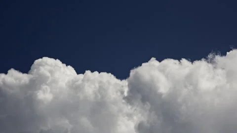 Expansive timelapse of dynamic contrasting and saturated clouds moving quickly Stock Footage 287869590